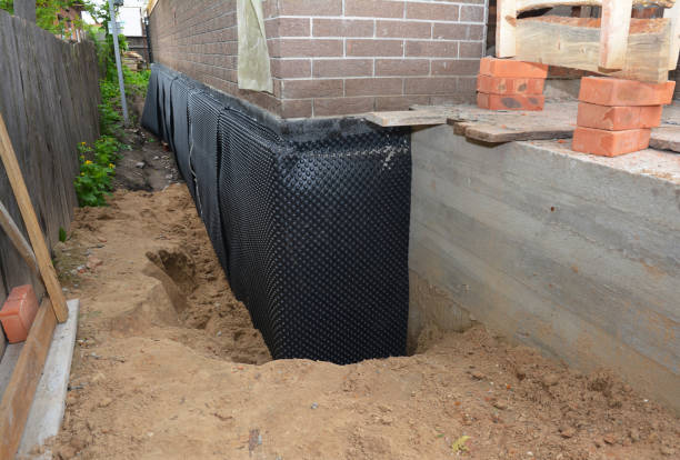 Happy homeowners after waterproofing job in Huron